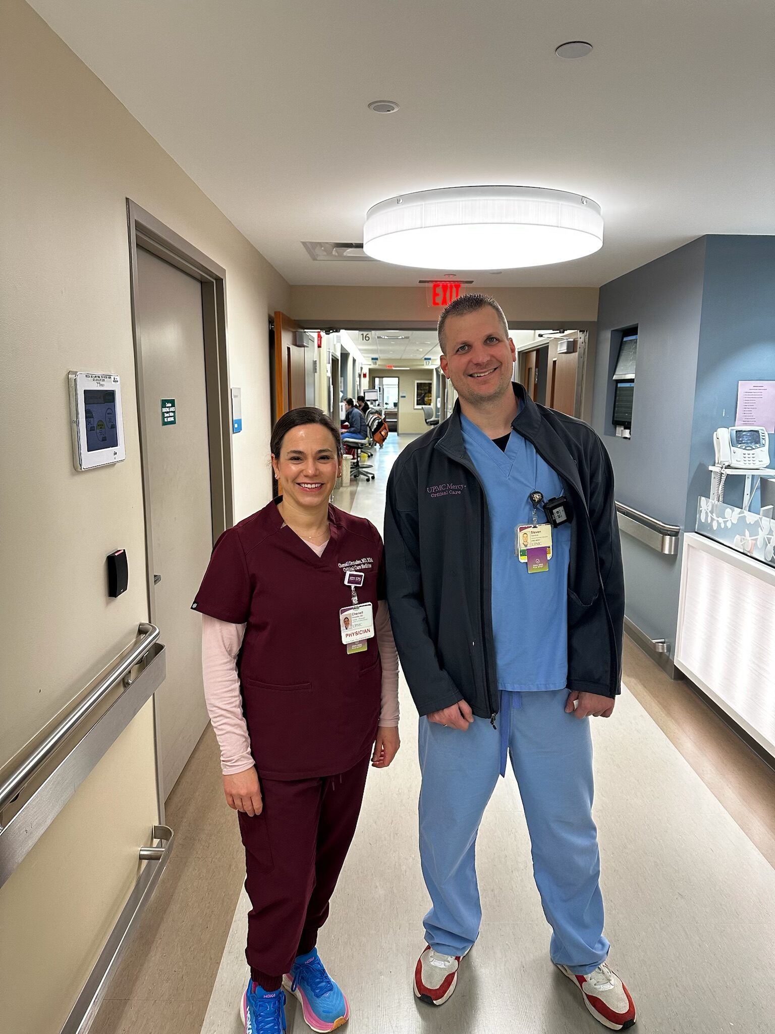 Dr. Chenell Donadee with a colleague in a hospital hallway.