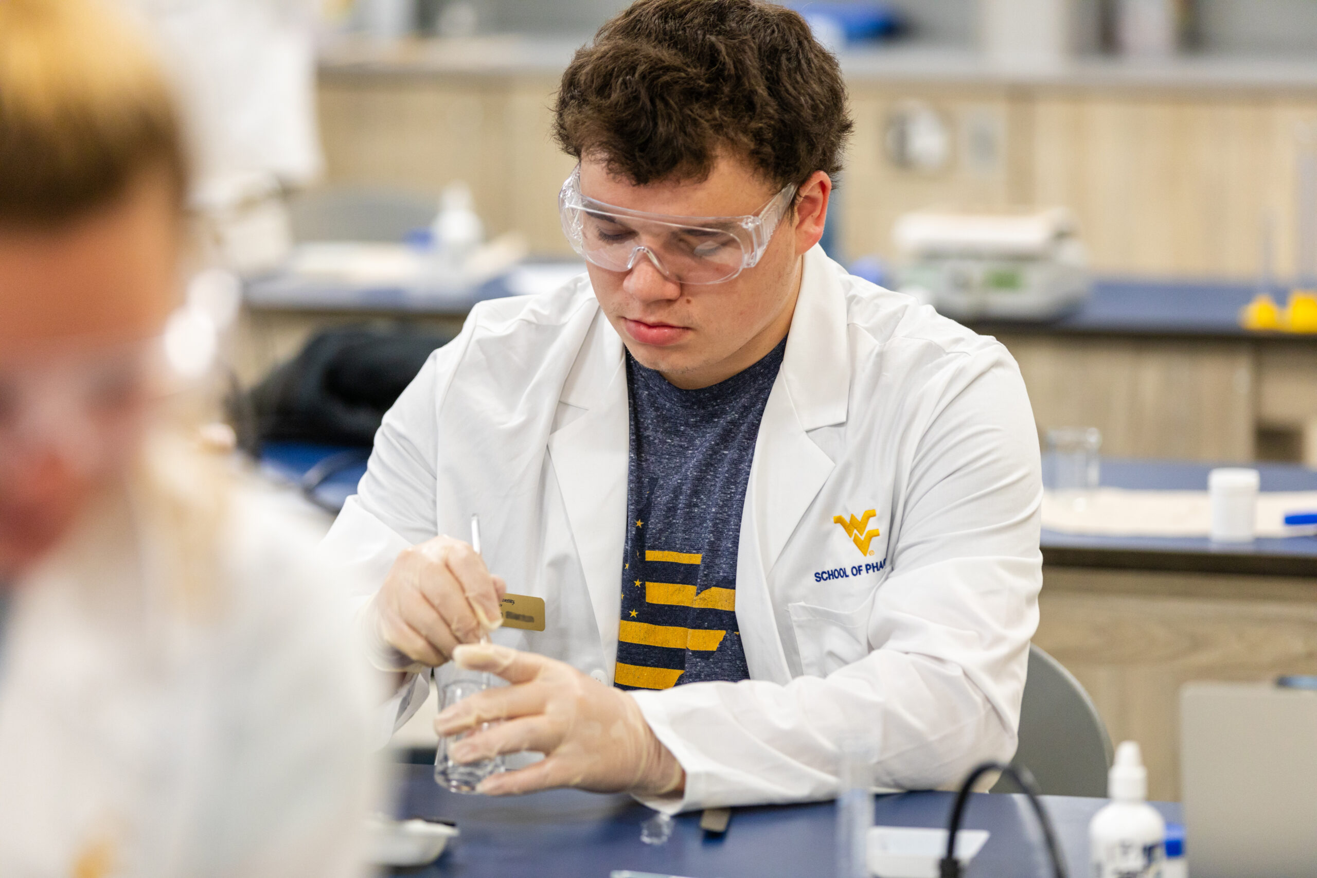 male pharmacy student in a lab
