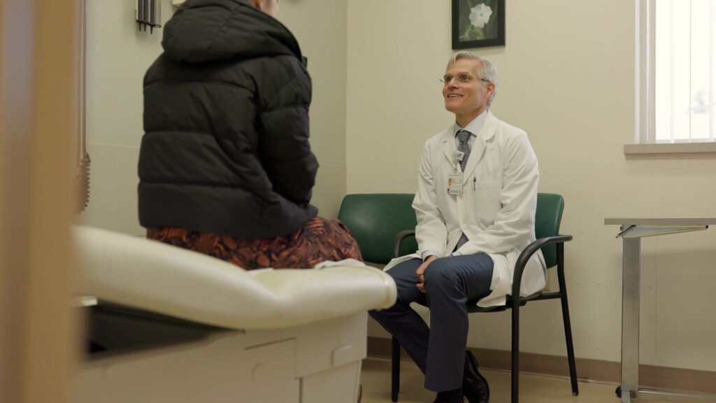 Dr. Robert R. Mayo talking with a patient.