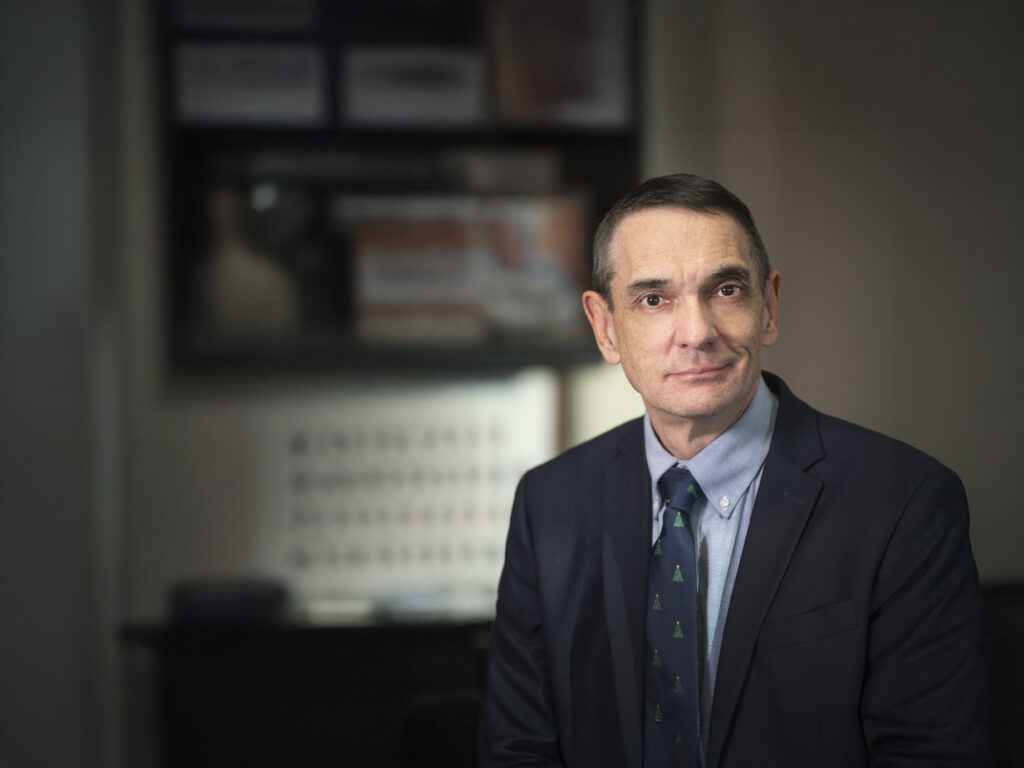 Dr. Gerald V. Maloney in an office setting.