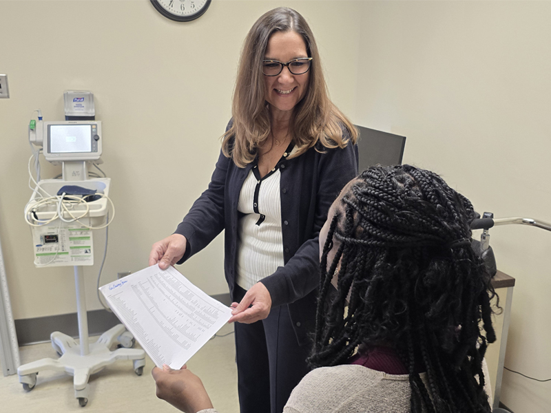 Amber Fifer sharing information with a patient.