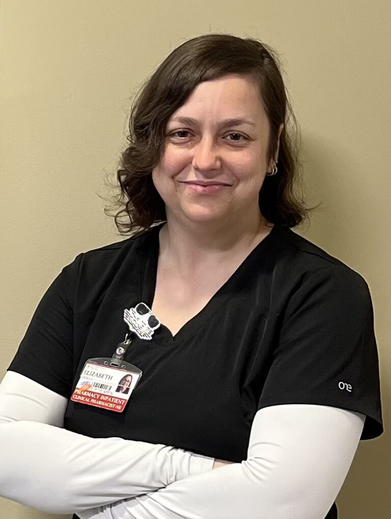 Dr. Elizabeth DeBell with her arms crossed.